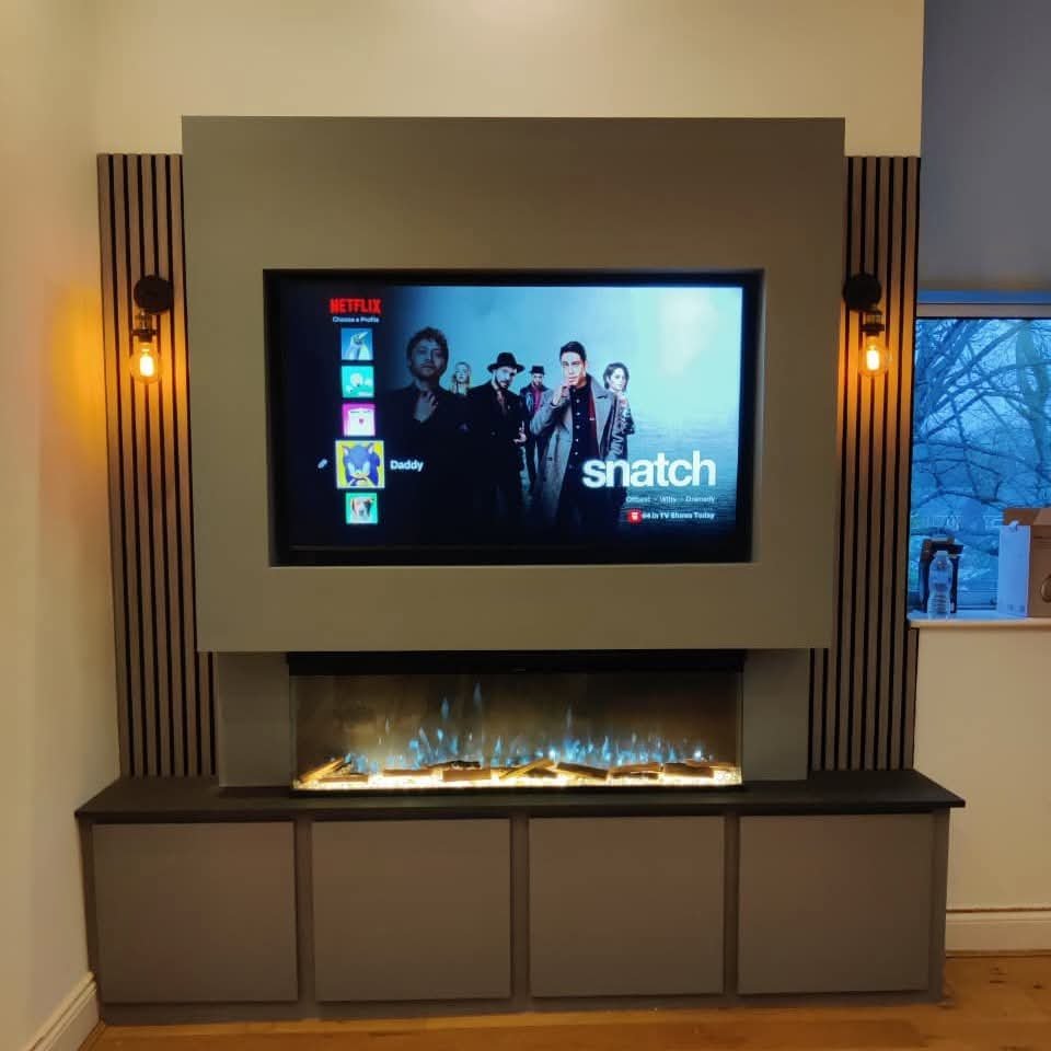 Media wall with Netflix on screen and illuminated fireplace